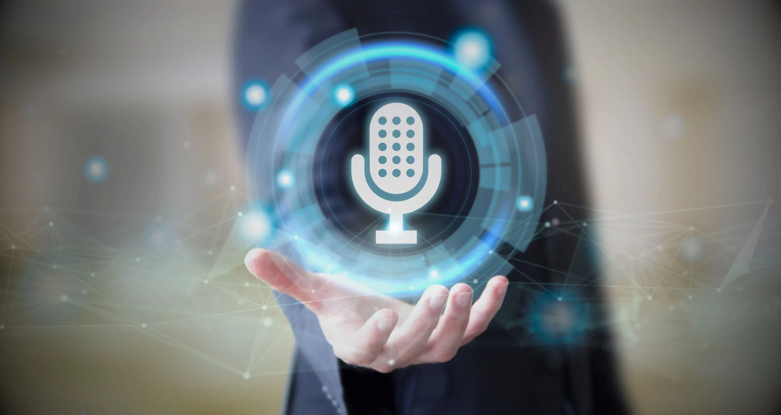 Person holding a glowing digital microphone icon, symbolizing brand voice and communication strategy